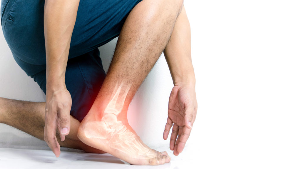 man suffering from leg pain