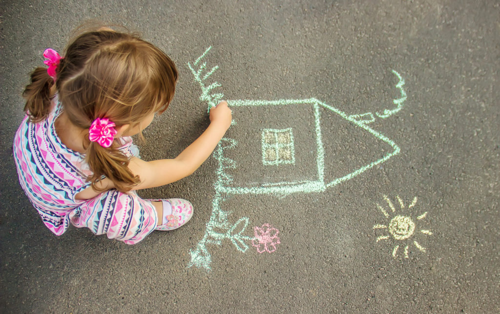 little girl making doodle art