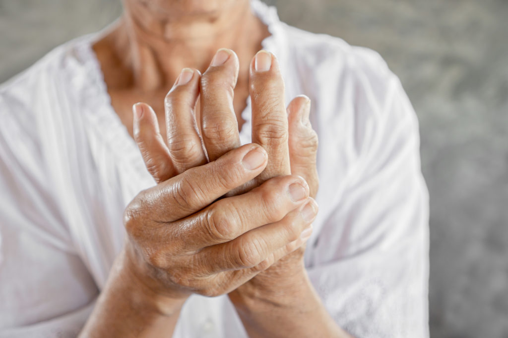 old man suffer hand arthritis pain