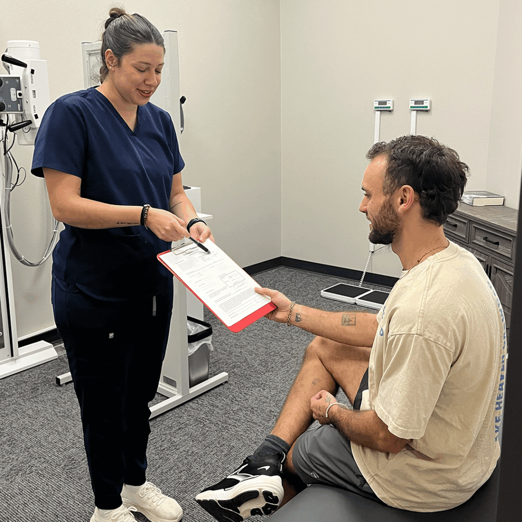 medical practitioner in tyler clinic giving patient form